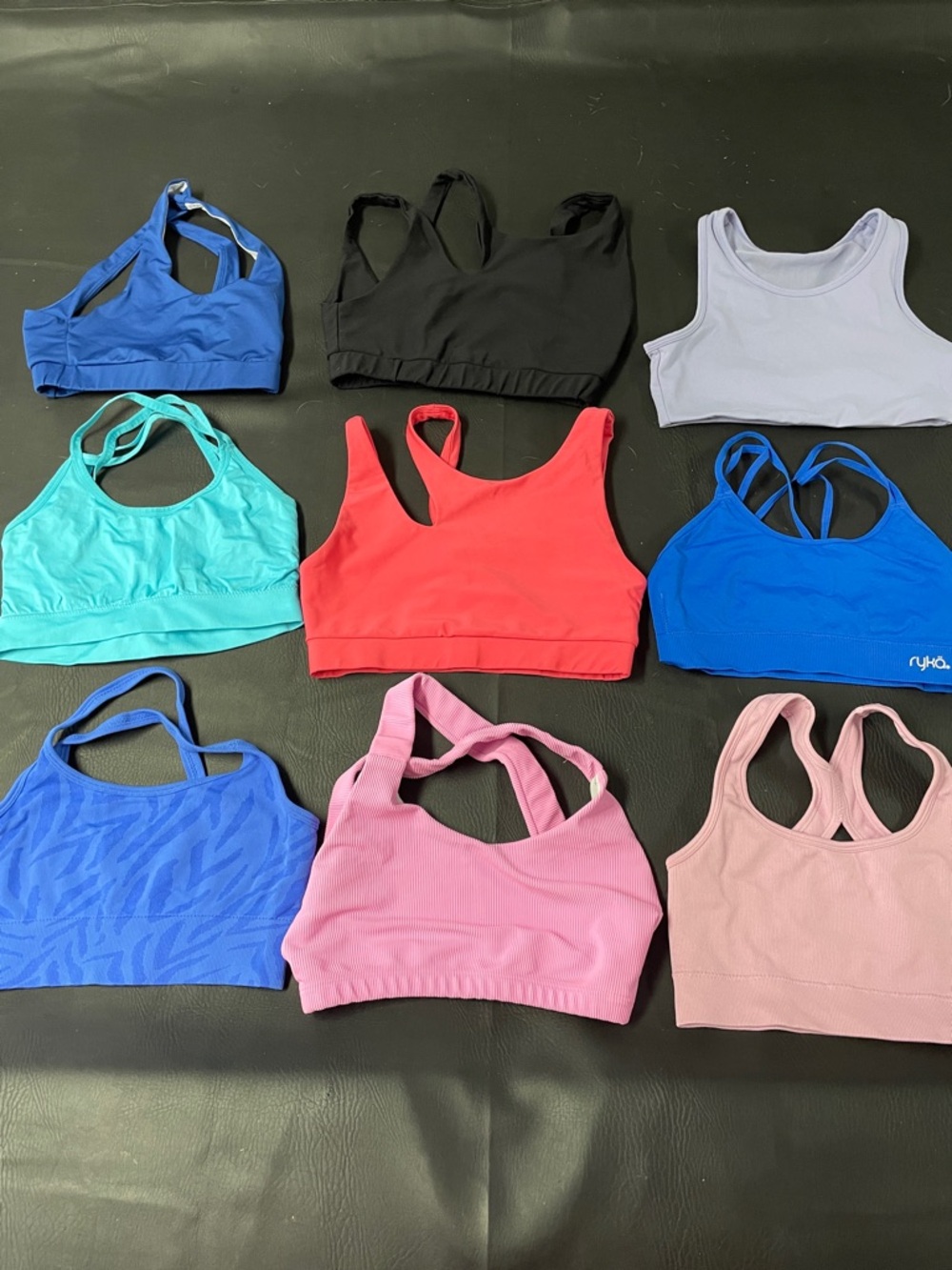 9 size small sports bras all in good condition for $20 take all!